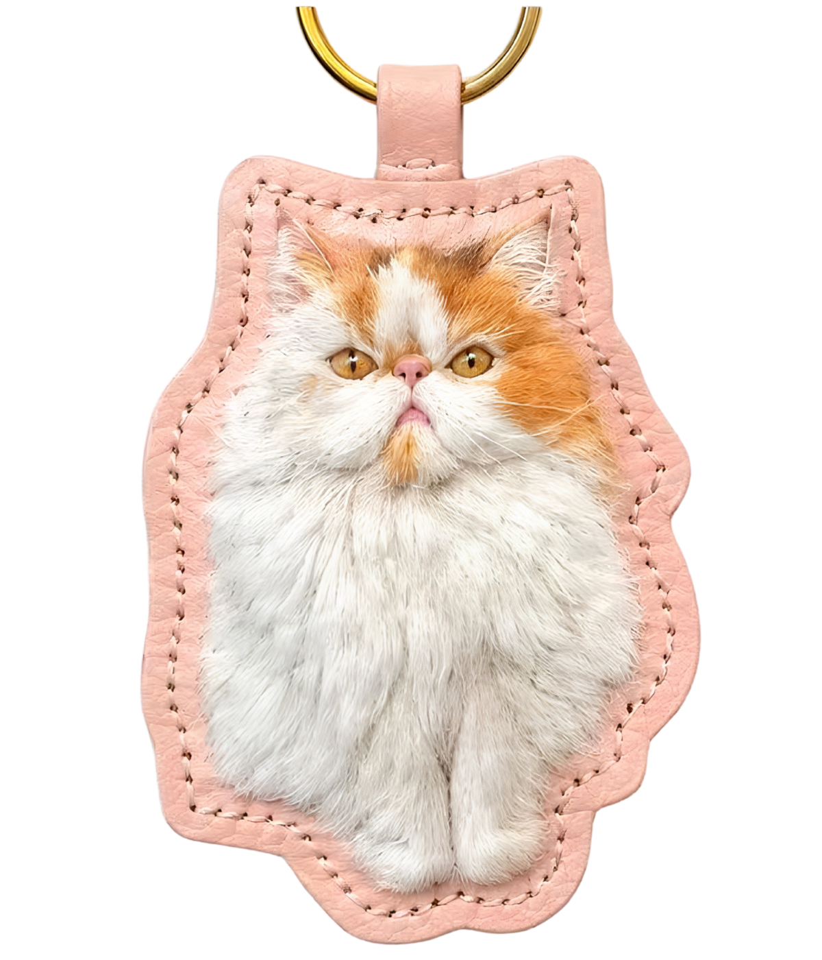 3D pet figurine keychain with white-and-orange cat face on pink stitched backing