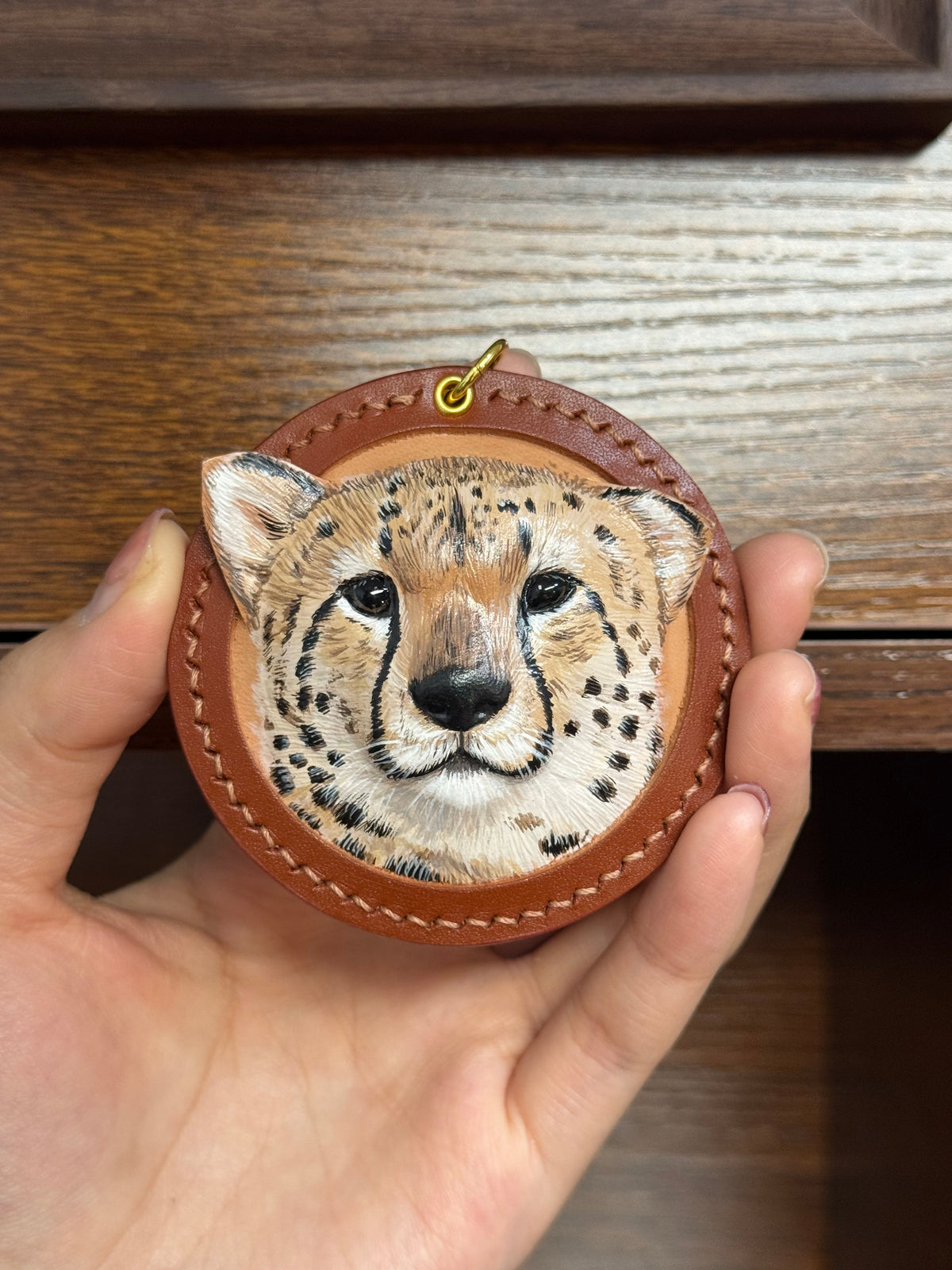 Tiger face key ring ornament in brown stitched leather with small gold top ring